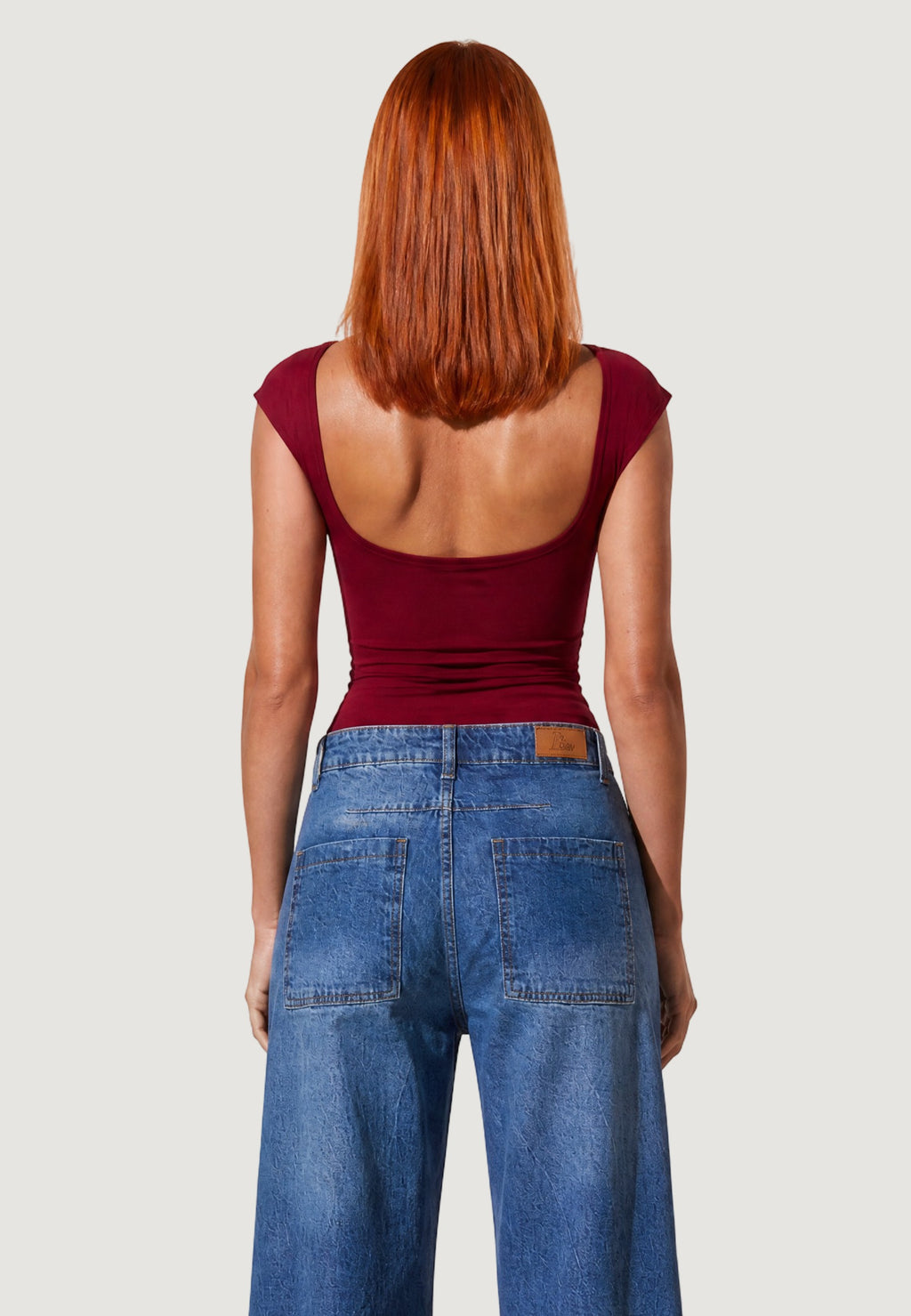 TOP CON SCOLLO DIETRO